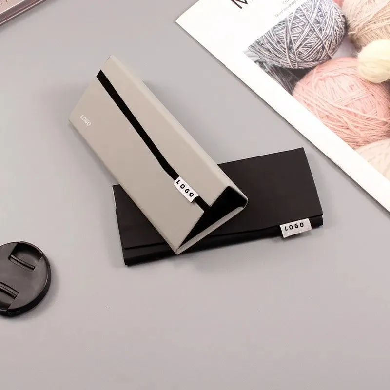 1776834768637_foldable-triangle-glasses-case-minimalist-pu-leather-sunglasses-storage-box-1.webp